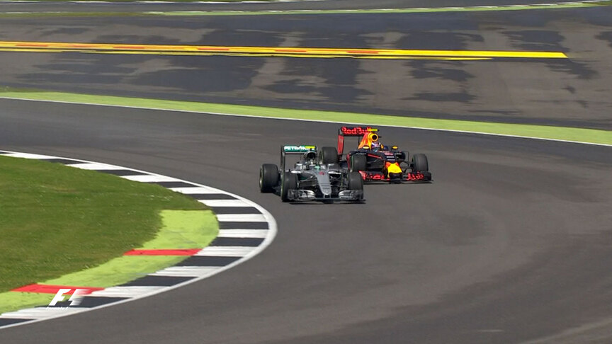 Max Verstappen overtakes Nico Rosberg around the outside at Chapel