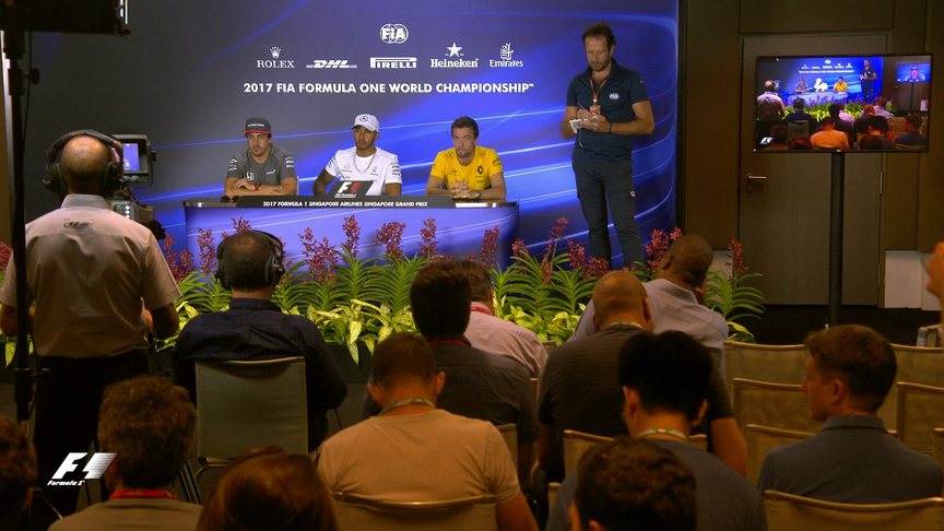 Drivers face the press in Singapore