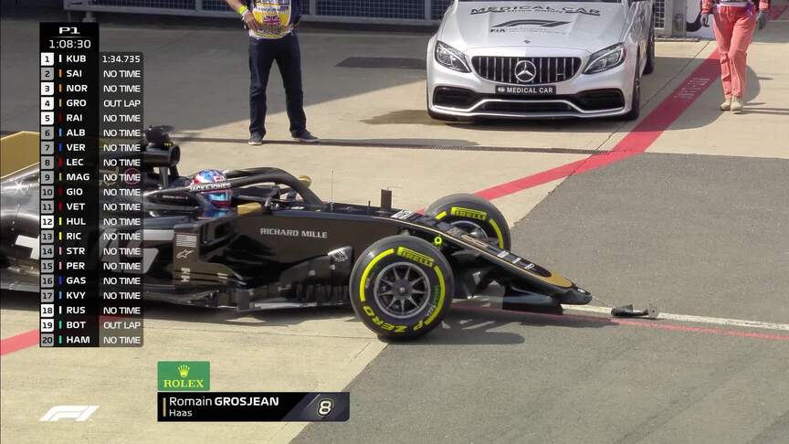 FP1: Grosjean loses front wing in bizarre pit-exit spin